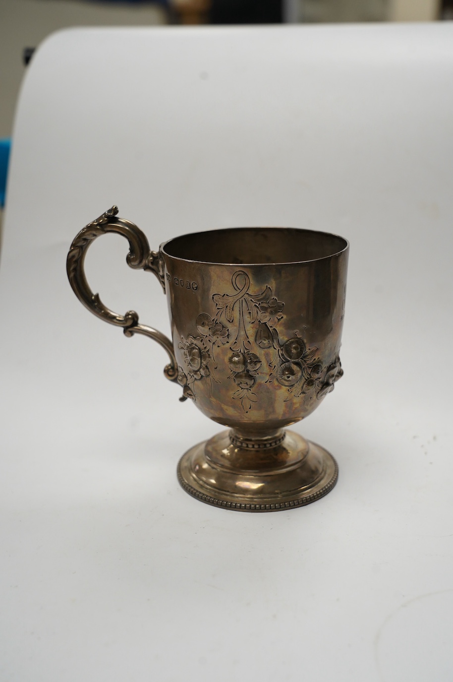 A Victorian silver pedestal christening cup, by Joseph Angell II, London, 1856, 11.5cm, 6.4oz, with later engraved inscription. Condition - fair